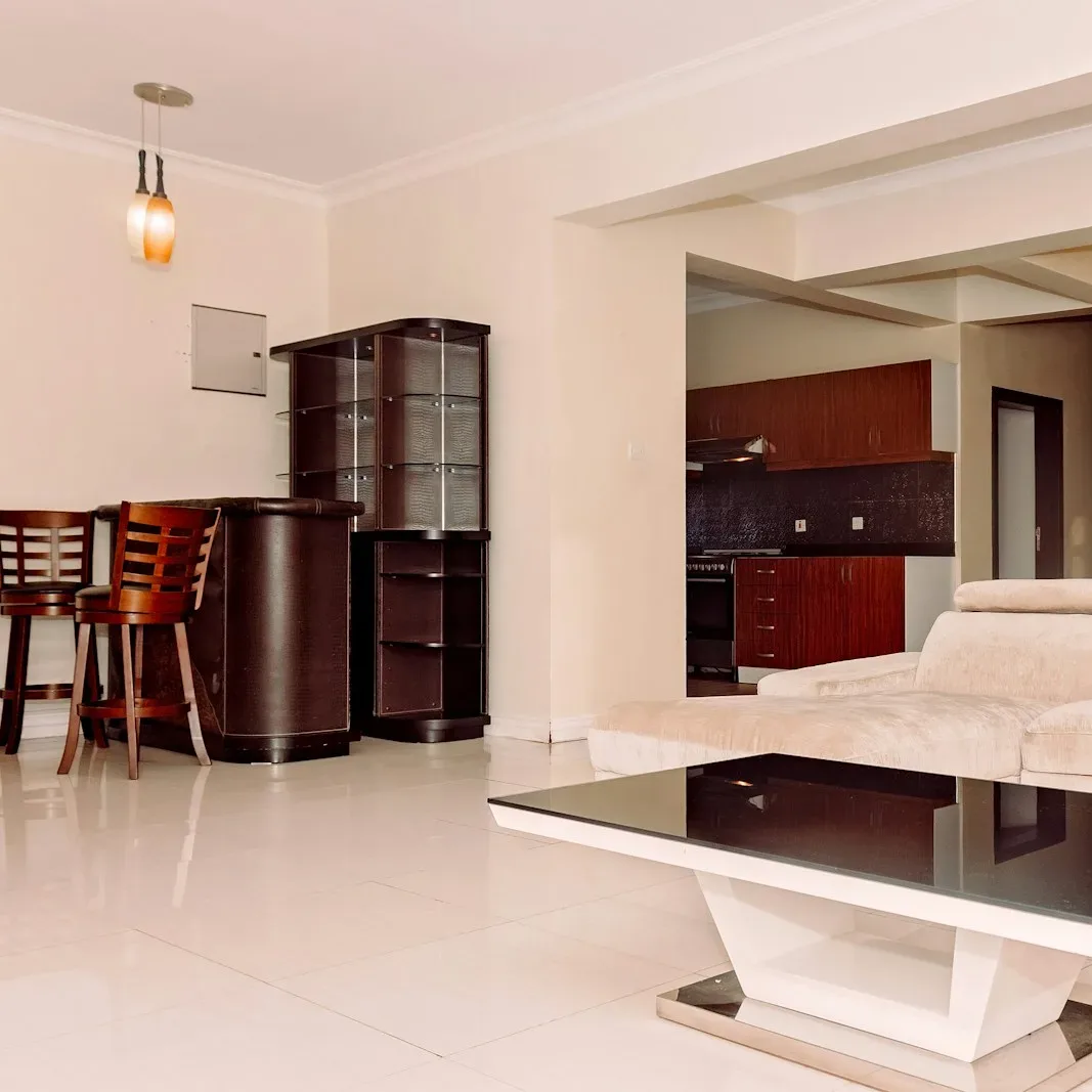 a living room filled with furniture and a table